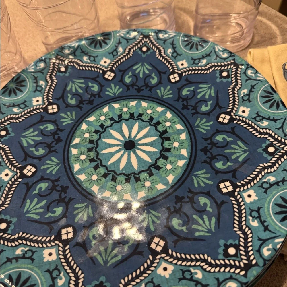 Blue Patterned Plates and Glasses with‎ Floral Napkins